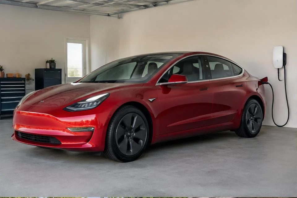 Original AI-generated illustration: Red Tesla Model 3-inspired electric sedan connected to a garage wall charging station